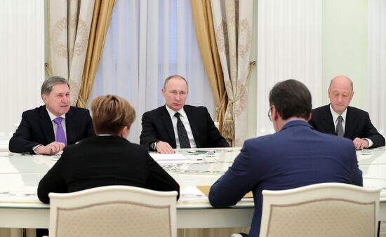 Russian President Vladimir Putin meets with Serbian Prime Minister Aleksandar Vucic