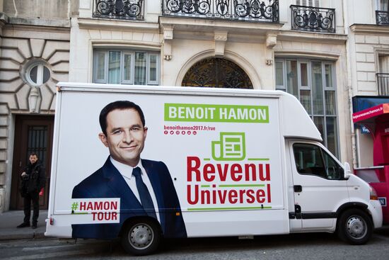Campaign vans featuring pictures of presidential candidate Benoit Hamon in France