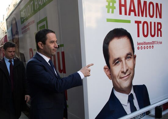 Campaign vans featuring pictures of presidential candidate Benoit Hamon in France