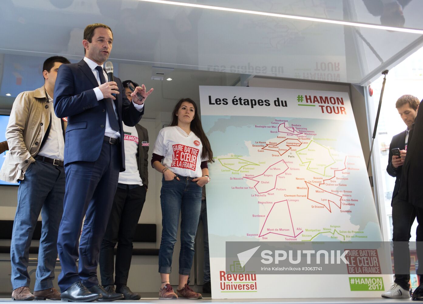 Campaign vans featuring pictures of presidential candidate Benoit Hamon in France