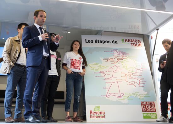 Campaign vans featuring pictures of presidential candidate Benoit Hamon in France