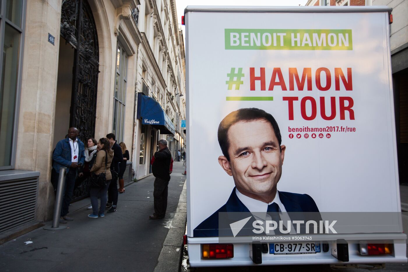 Campaign vans featuring pictures of presidential candidate Benoit Hamon in France