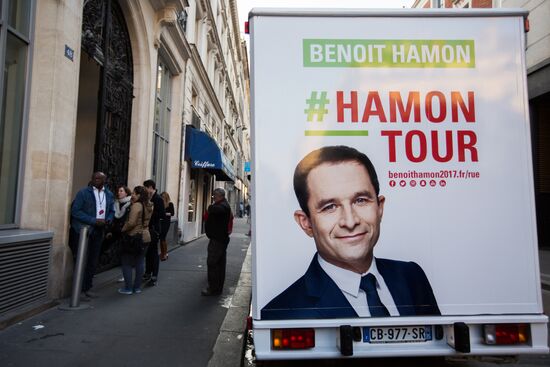 Campaign vans featuring pictures of presidential candidate Benoit Hamon in France