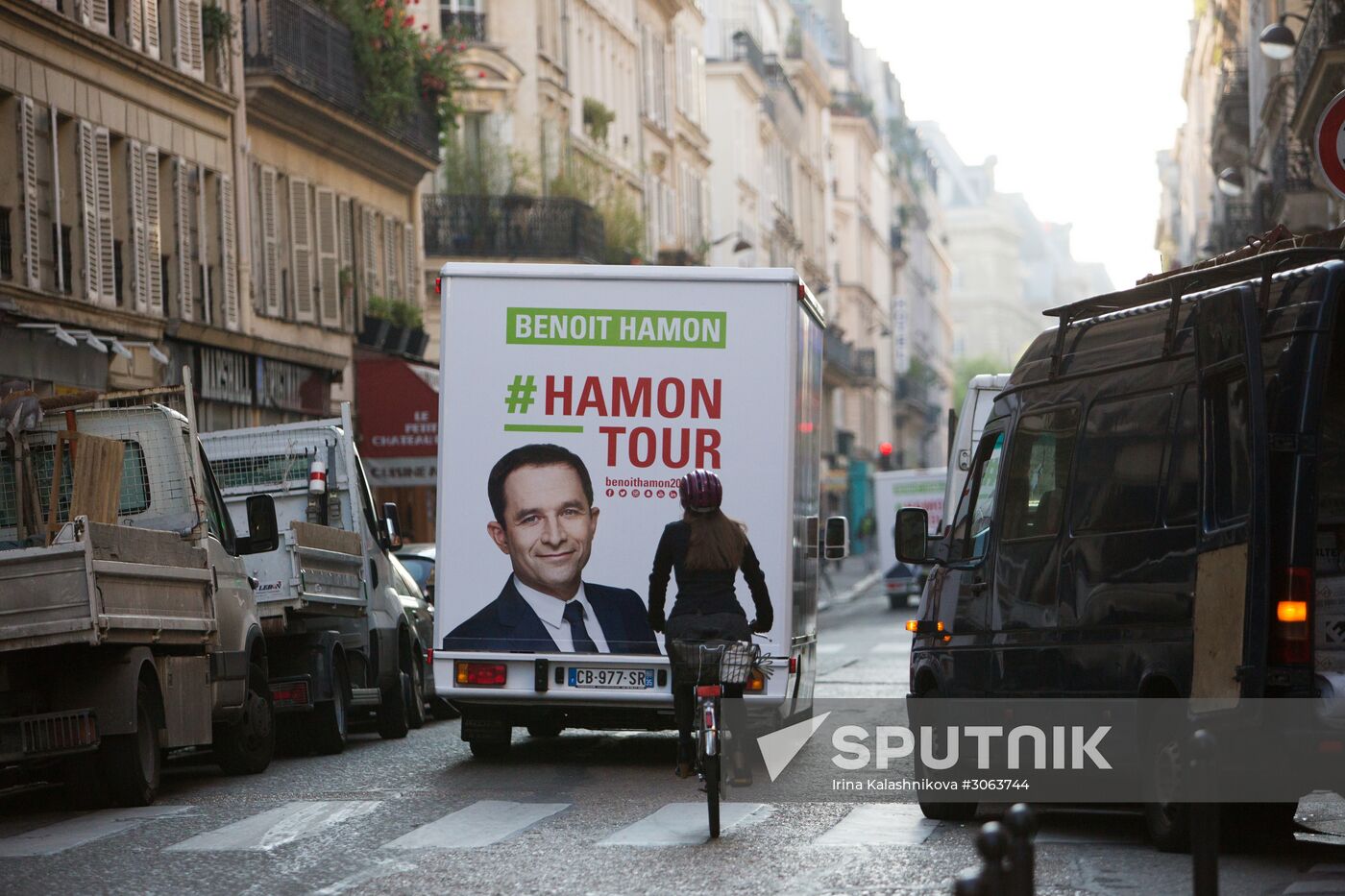 Campaign vans featuring pictures of presidential candidate Benoit Hamon in France