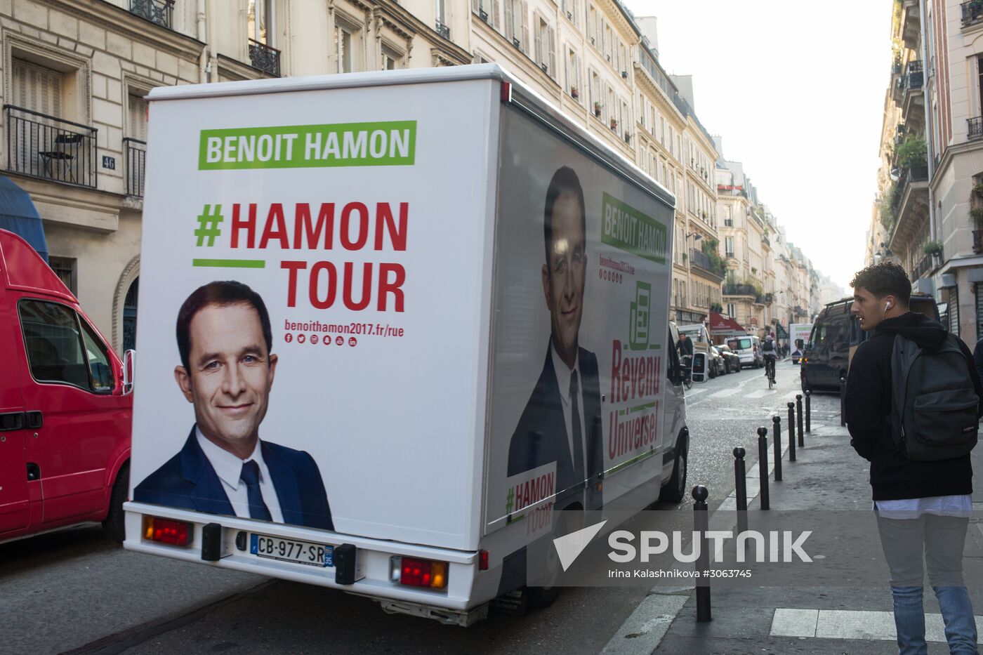 Campaign vans featuring pictures of presidential candidate Benoit Hamon in France