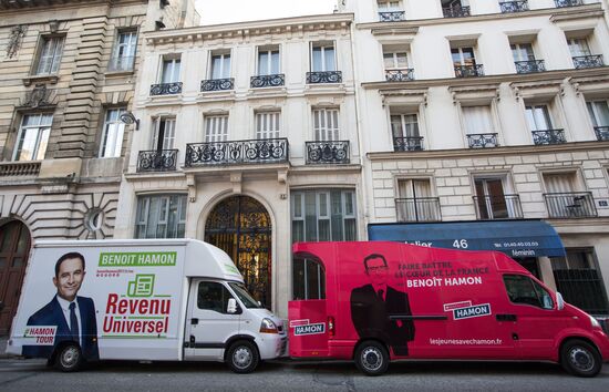 Campaign vans featuring pictures of presidential candidate Benoit Hamon in France