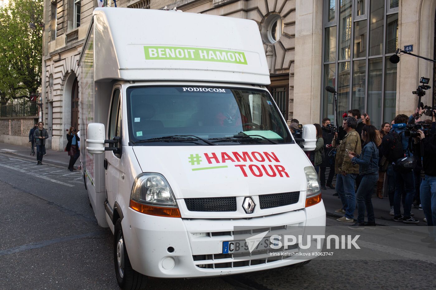 Campaign vans featuring pictures of presidential candidate Benoit Hamon in France