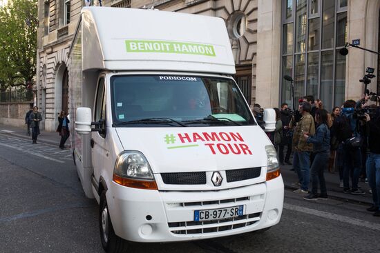 Campaign vans featuring pictures of presidential candidate Benoit Hamon in France