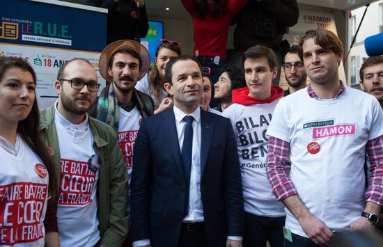 Campaign vans featuring pictures of presidential candidate Benoit Hamon in France