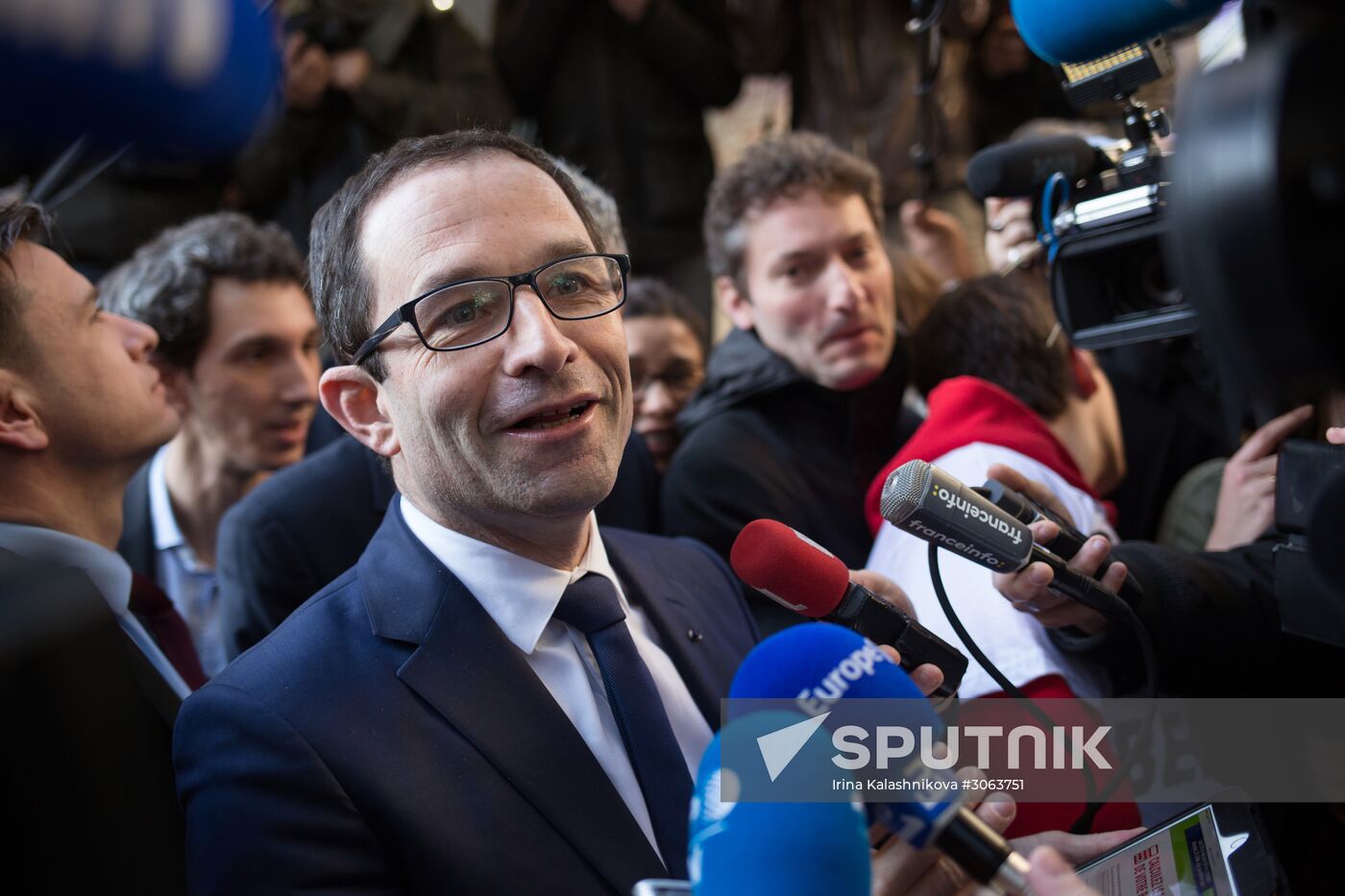 Campaign vans featuring pictures of presidential candidate Benoit Hamon in France
