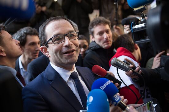 Campaign vans featuring pictures of presidential candidate Benoit Hamon in France