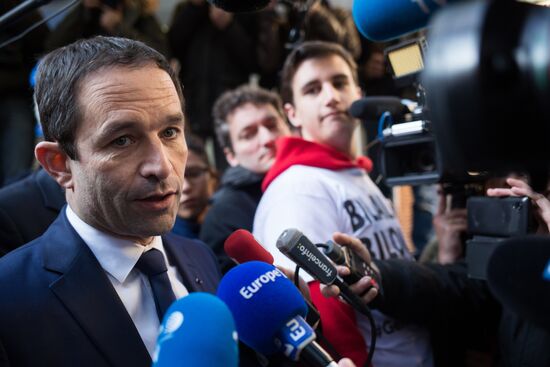 Campaign vans featuring pictures of presidential candidate Benoit Hamon in France
