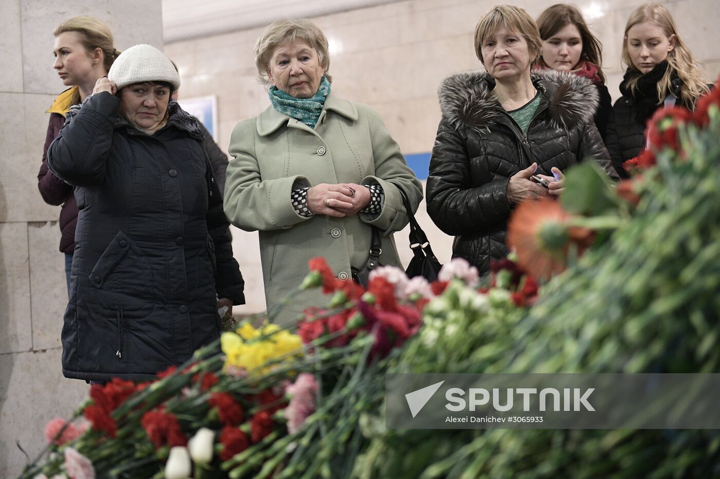 People bring flowers at Tekhnologichesky Institut