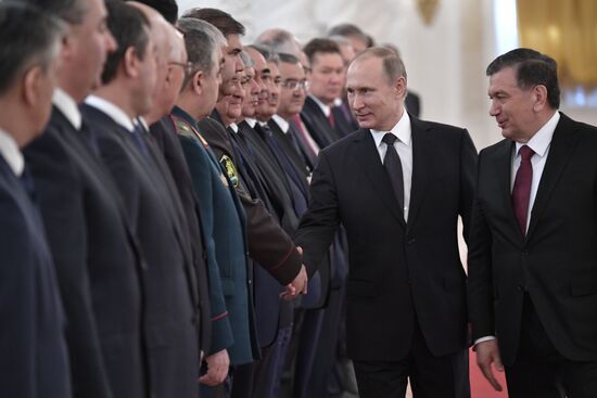 Russian President Vladimir Putin meets with President of Uzbekistan Shavkat Mirziyoyev