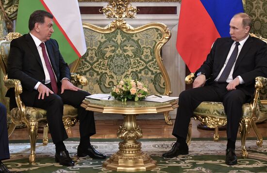 Russian President Vladimir Putin meets with President of Uzbekistan Shavkat Mirziyoyev