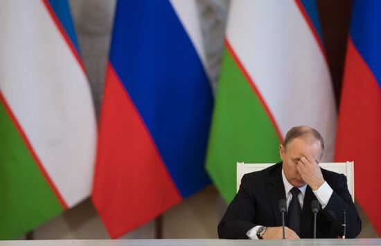 Russian President Vladimir Putin meets with President of Uzbekistan Shavkat Mirziyoyev