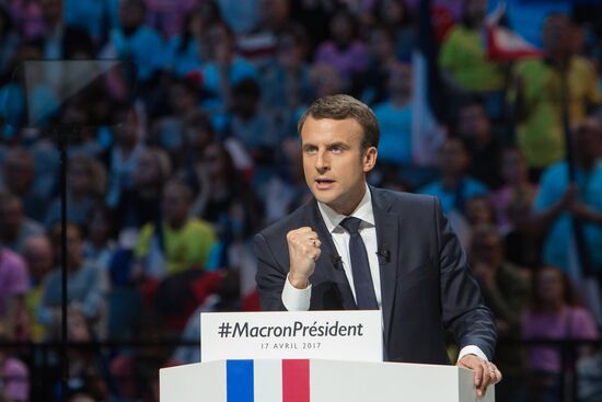 Emmanuel Macron meets with voters in Paris