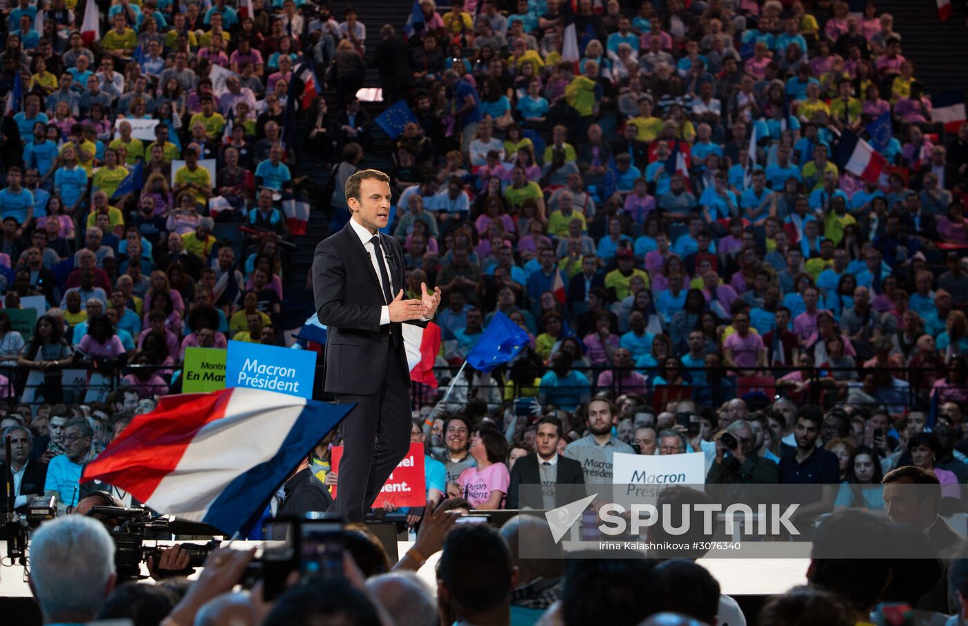 Emmanuel Macron meets with voters in Paris