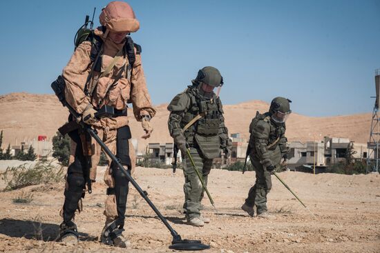 Russian mine pickers use new robotic systems during mine lifting in Palmyra
