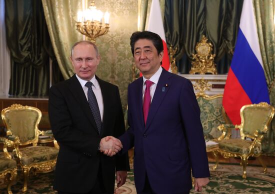 Russian President Vladimir Putin meets with Japanese Prime Minister Shinzo Abe