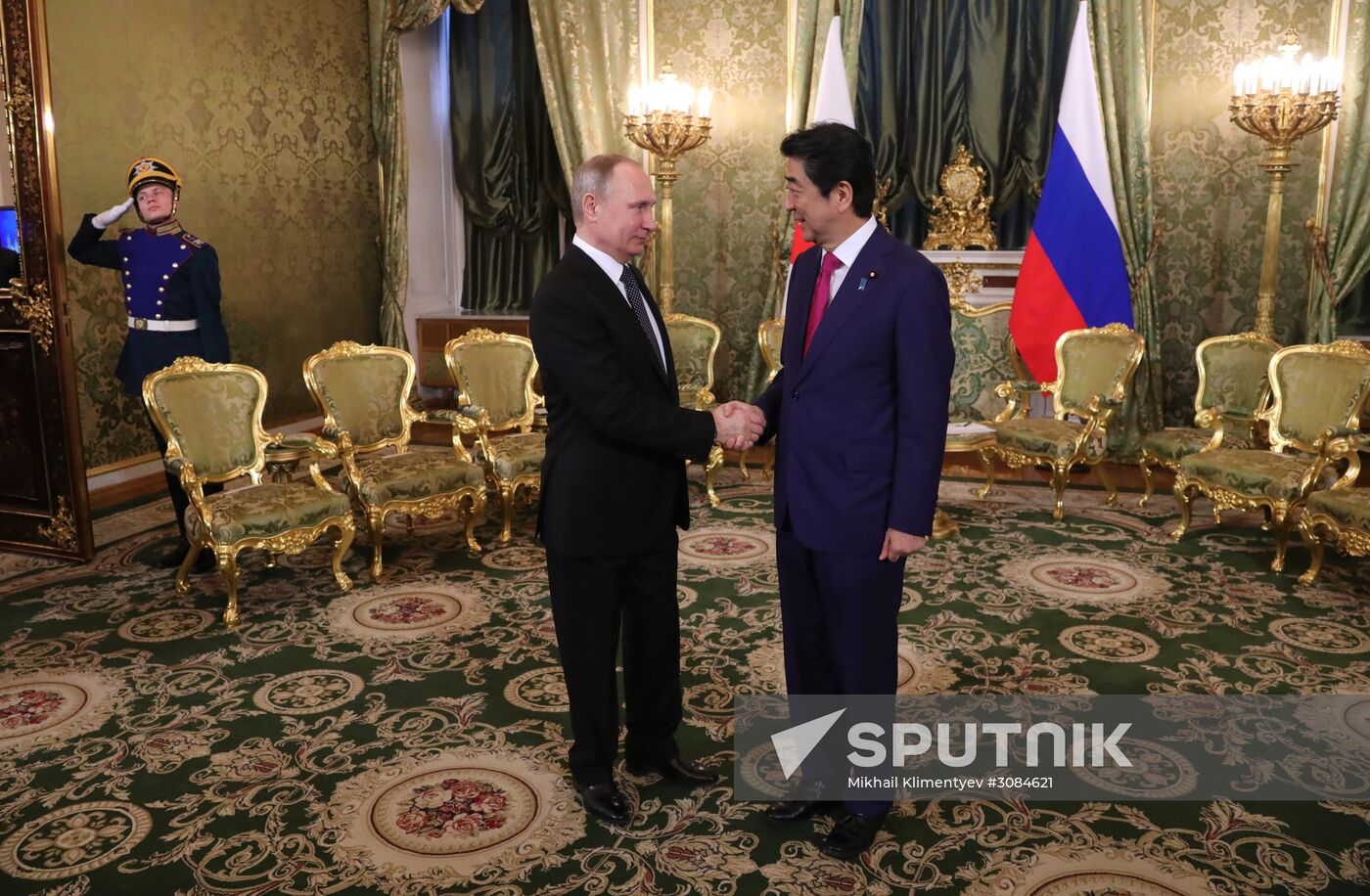 Russian President Vladimir Putin meets with Japanese Prime Minister Shinzo Abe