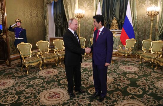 Russian President Vladimir Putin meets with Japanese Prime Minister Shinzo Abe