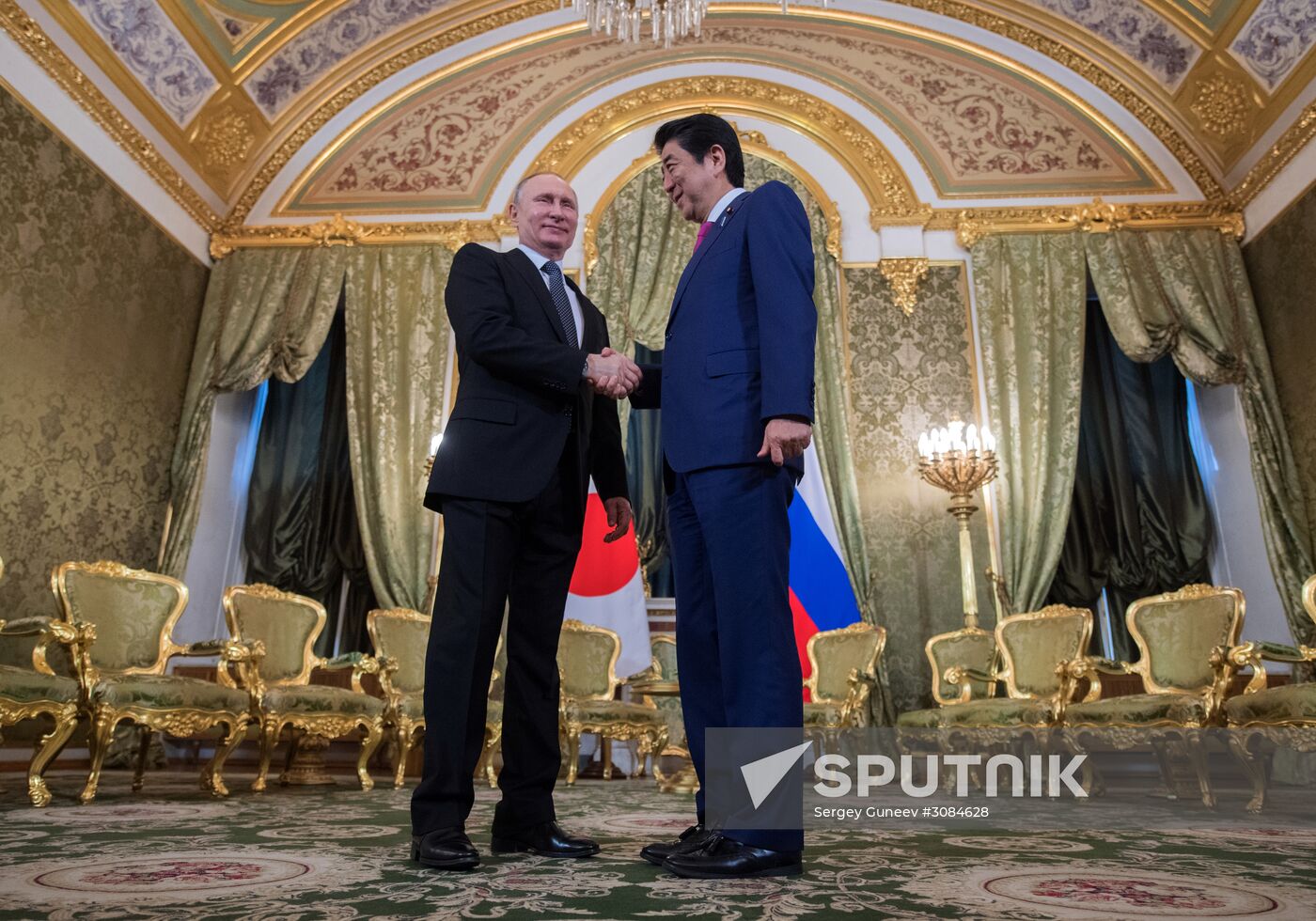 Russian President Vladimir Putin meets with Japanese Prime Minister Shinzo Abe