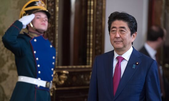 Russian President Vladimir Putin meets with Japanese Prime Minister Shinzo Abe