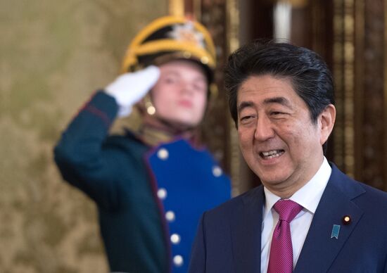 Russian President Vladimir Putin meets with Japanese Prime Minister Shinzo Abe