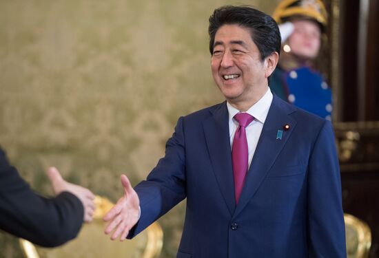 Russian President Vladimir Putin meets with Japanese Prime Minister Shinzo Abe