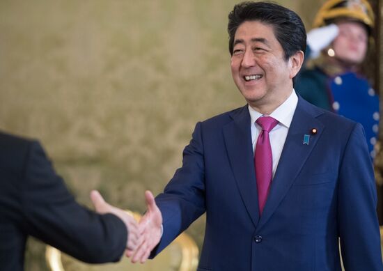 Russian President Vladimir Putin meets with Japanese Prime Minister Shinzo Abe