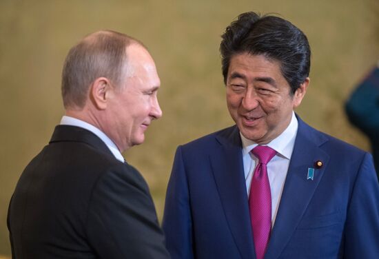 Russian President Vladimir Putin meets with Japanese Prime Minister Shinzo Abe