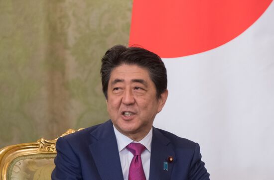 Russian President Vladimir Putin meets with Japanese Prime Minister Shinzo Abe