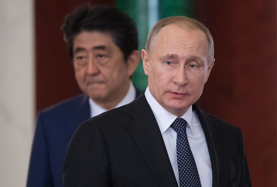 Russian President Vladimir Putin meets with Japanese Prime Minister Shinzo Abe