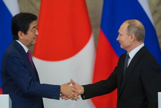 Russian President Vladimir Putin meets with Japanese Prime Minister Shinzo Abe