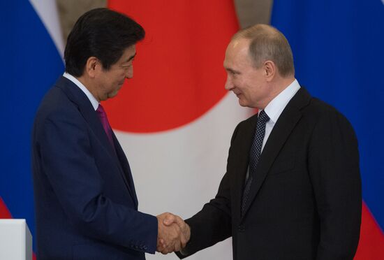 Russian President Vladimir Putin meets with Japanese Prime Minister Shinzo Abe