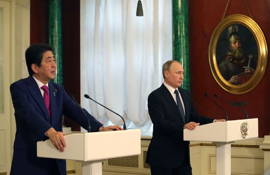 Russian President Vladimir Putin meets with Japanese Prime Minister Shinzo Abe