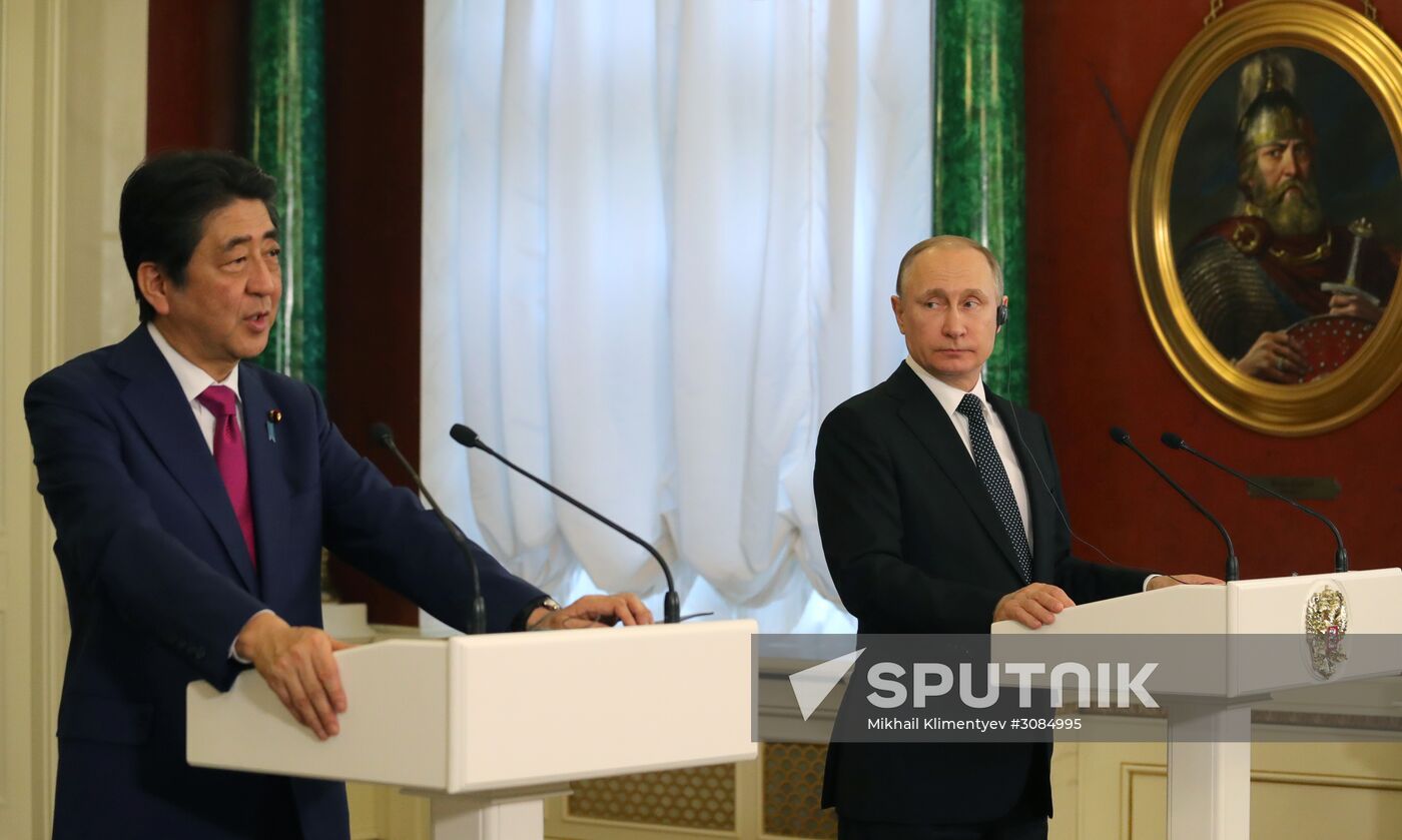 Russian President Vladimir Putin meets with Japanese Prime Minister Shinzo Abe
