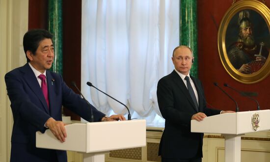 Russian President Vladimir Putin meets with Japanese Prime Minister Shinzo Abe