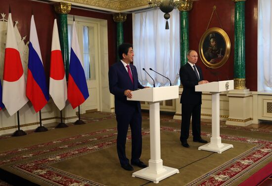 Russian President Vladimir Putin meets with Japanese Prime Minister Shinzo Abe