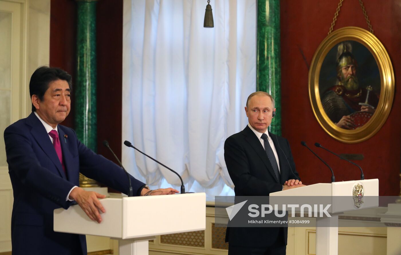 Russian President Vladimir Putin meets with Japanese Prime Minister Shinzo Abe