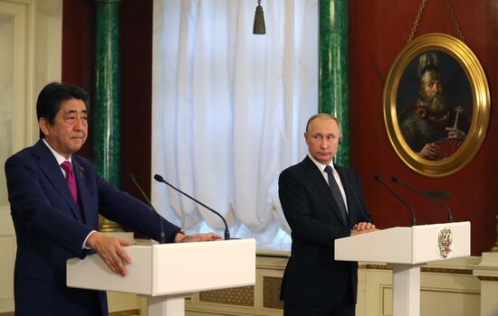Russian President Vladimir Putin meets with Japanese Prime Minister Shinzo Abe