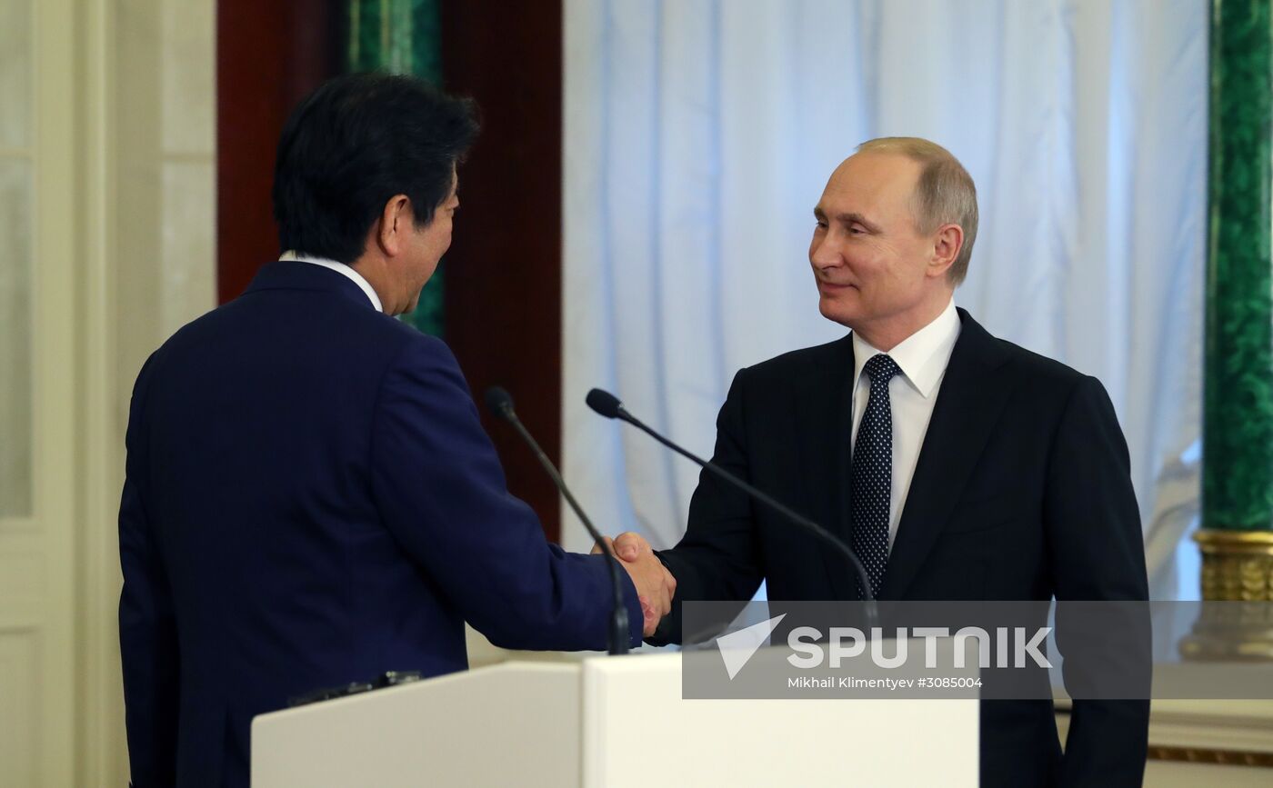 Russian President Vladimir Putin meets with Japanese Prime Minister Shinzo Abe