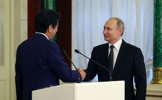 Russian President Vladimir Putin meets with Japanese Prime Minister Shinzo Abe