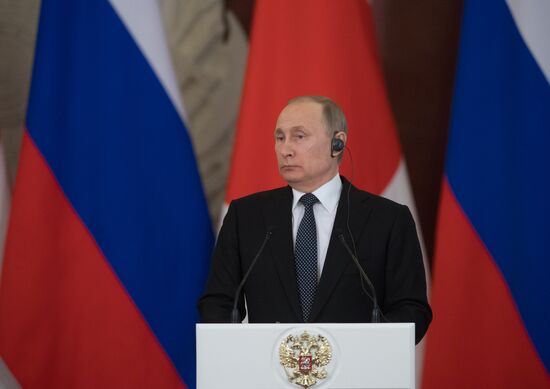 Russian President Vladimir Putin meets with Japanese Prime Minister Shinzo Abe