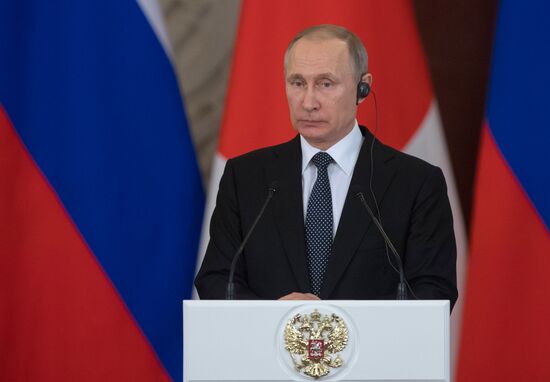 Russian President Vladimir Putin meets with Japanese Prime Minister Shinzo Abe