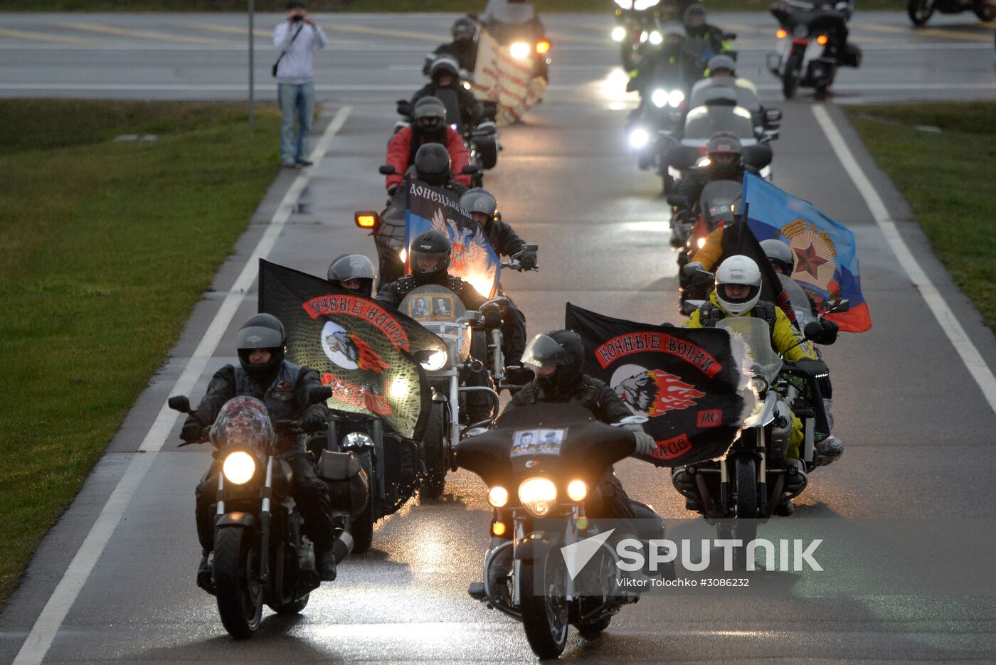 Night Wolves motorcycle club members lay flowers at the Mound of Glory in Minsk