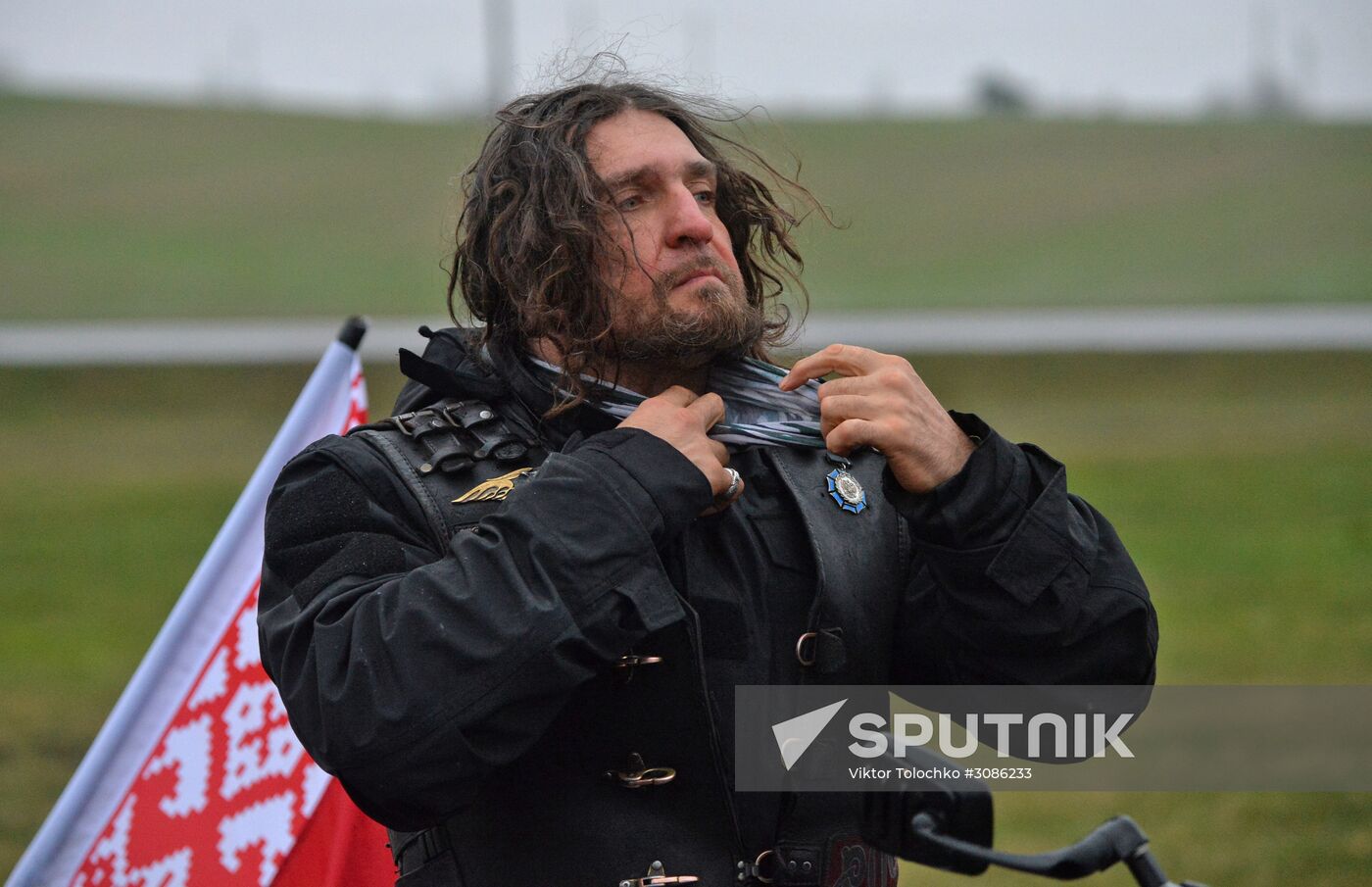Night Wolves motorcycle club members lay flowers at the Mound of Glory in Minsk
