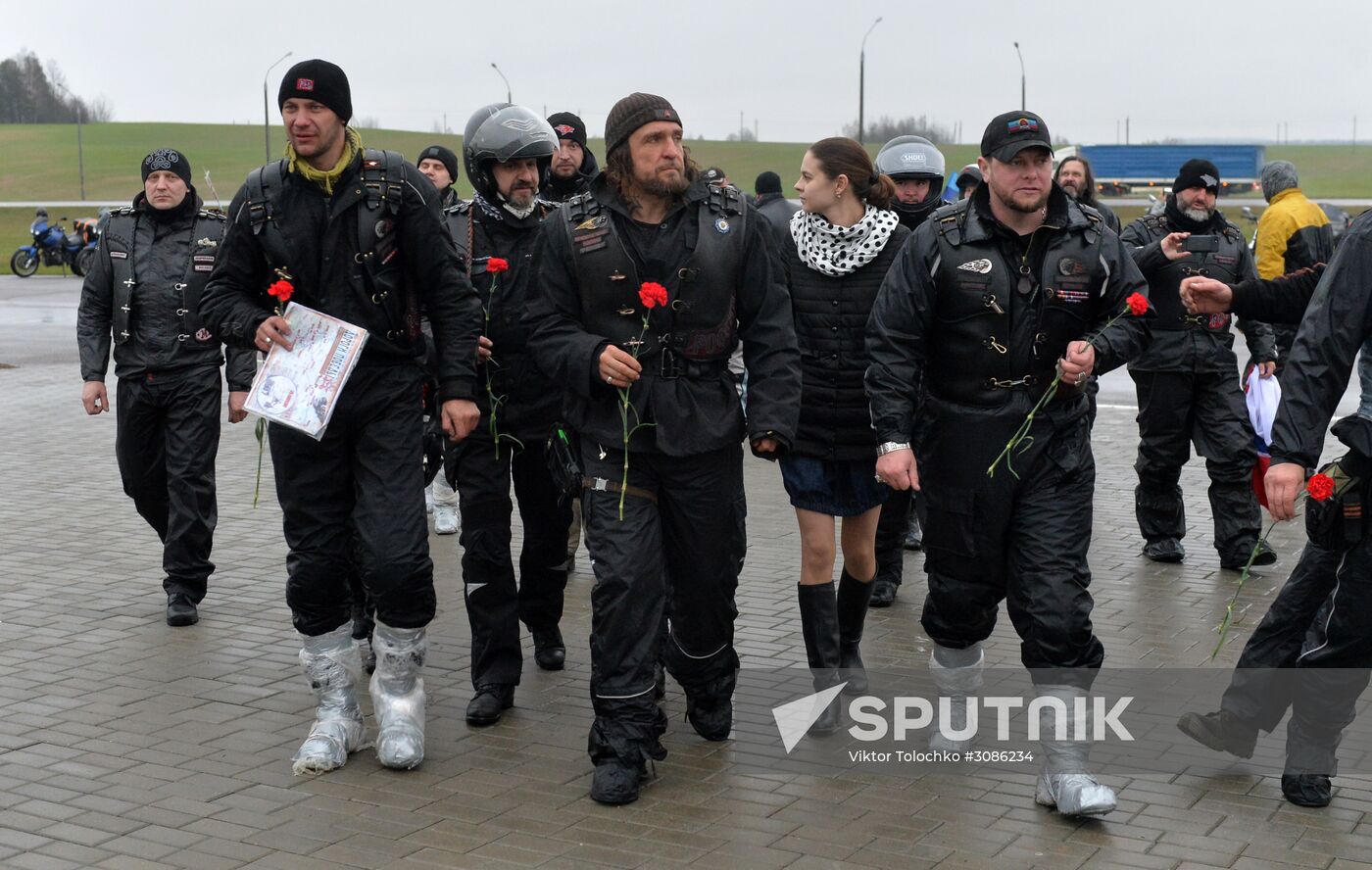 Night Wolves motorcycle club members lay flowers at the Mound of Glory in Minsk