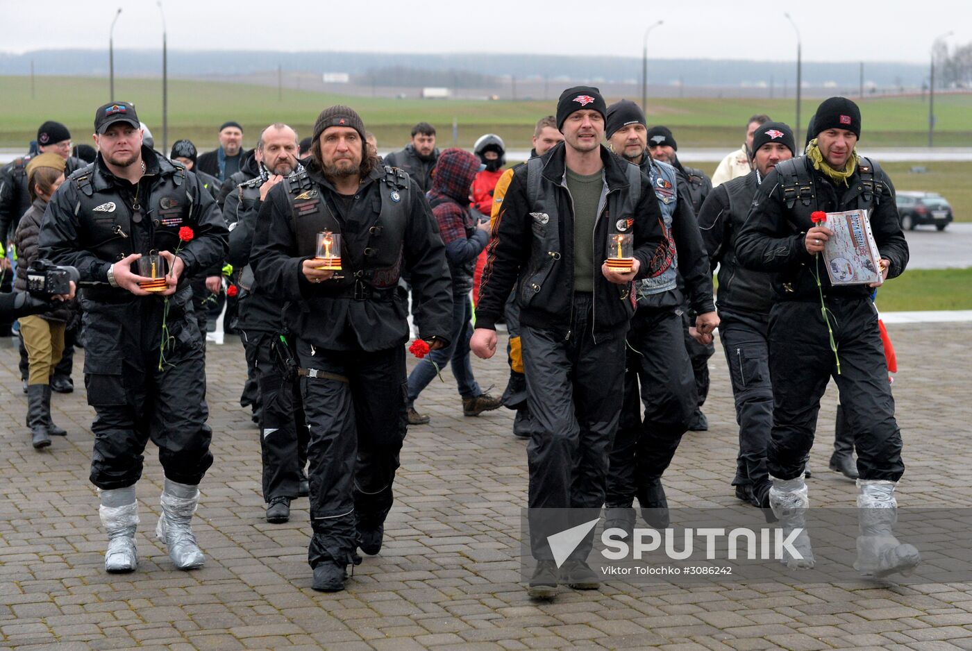 Night Wolves motorcycle club members lay flowers at the Mound of Glory in Minsk